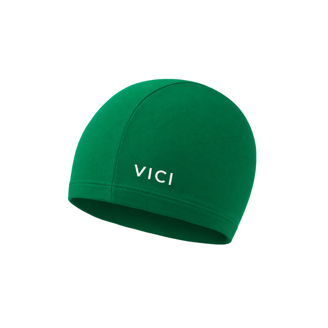 A green swim cap made from Lycra or nylon